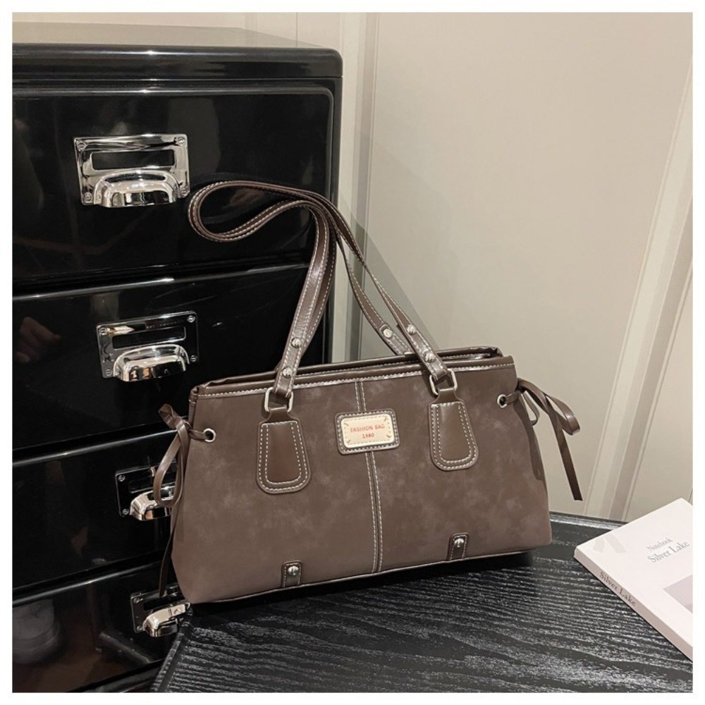 Minimalistyczna torba typu tot – Top Handle Structured recenzja i cena